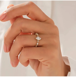 Macro view of gold irregular marquise cut zircon ring showcasing elegant craftsmanship