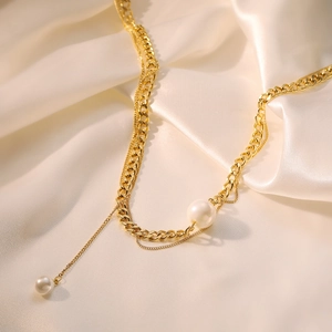 Elegant gold double-layered titanium steel Y-shaped necklace with white pearls on silk