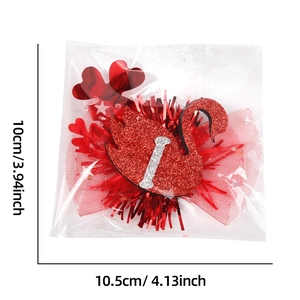 Detail of red glitter swan hair clip with mesh and '1' charm in 10.5cm size packaging