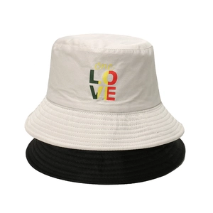 Double-sided sun hat featuring 'one LOVE' rainbow print in black and white styles