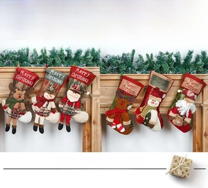 Detail of Christmas fireplace stockings with 3D Santa, Snowman and Reindeer figurines