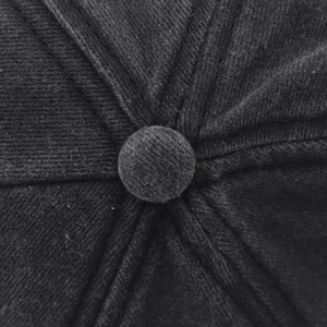 Top detail of black washed cotton baseball cap showing button and stitched panels