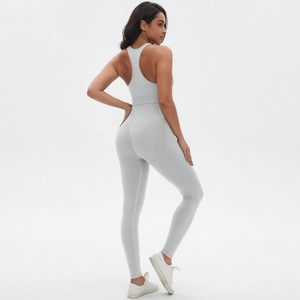 Detail of grey seamless yoga set showing high-waist leggings and sports bra fit