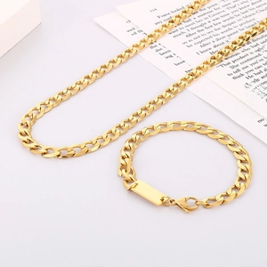 Hip hop gold stainless steel Cuban link chain set with square tag on book background