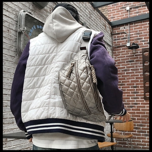 Silver quilted nylon crossbody chest bag with adjustable strap shown from the back view