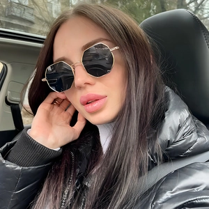 Fashion polygon sunglasses with gold metal frame and dark lenses for modern style