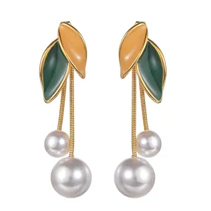 Gold stainless steel long leaf earrings with enamel details and dangling double pearls