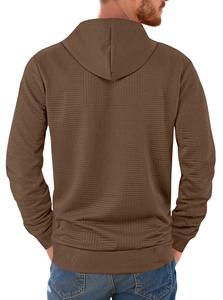 Detail view of men's brown hoodie featuring geometric embossed texture and knit pattern