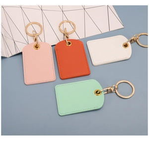 Close-up of PU leather access card covers in pink, orange, white and mint green colors