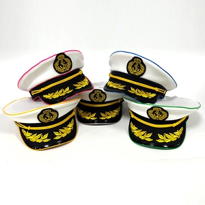 Detail of captain hats with colorful piping and golden olive branch embroidery