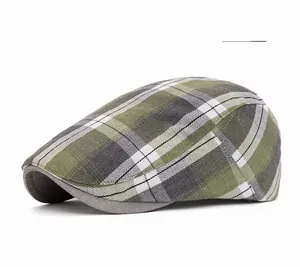 Close-up of green plaid newsboy cap with classic British flat hat fabric texture