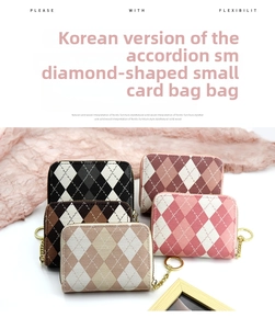 Macro shot of accordion card wallets with plaid texture and golden chain zippers