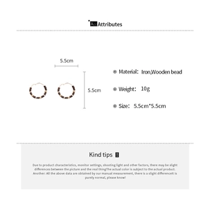 Detailed view of 5.5cm retro hoop earrings featuring iron and wooden bead construction