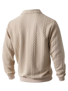 Rear view of beige cable knit sweater showing detailed jacquard and honeycomb texture