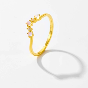 Detail of S925 silver ring in gold finish featuring opal stone and cubic zirconia