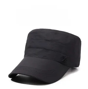Detail of black military style flat top cap featuring reinforced stitching and YS embroidery