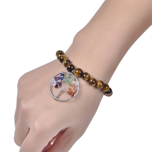 Natural tiger eye beaded bracelet featuring a silver tree of life charm with colorful stones