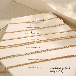 Detail view of gold alloy and pearl layered bracelets with measurements and weight info