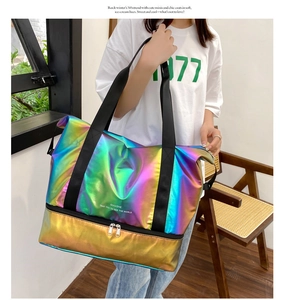 Detail of holographic travel bag showing the bottom shoe compartment and large capacity