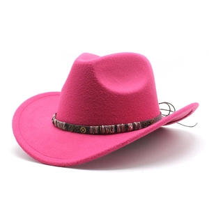 Detail of rose red cowboy hat with leather band, bronze gears and woven patterns