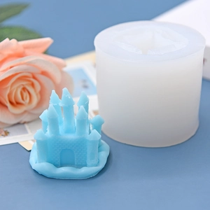 DIY castle shaped silicone mold with a light blue finished resin cake or candle project
