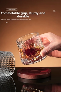 Detailed view of textured whiskey glasses featuring ripple and diamond patterns on wood base