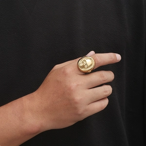 Punk style gold skull ring for men made of stainless steel shown on a hand