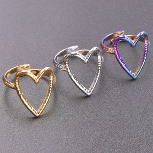 Three hammered heart open rings in gold, silver, and rainbow stainless steel finishes