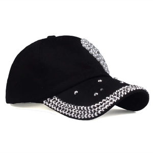 Black cotton baseball cap with silver rhinestone heart and pearl trim on brim