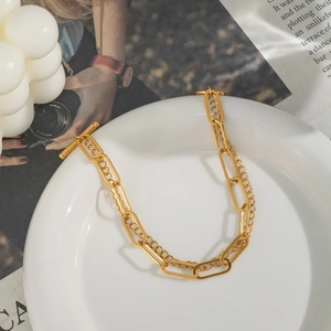 Detail of 18K gold-plated double-layer chain bracelet with elegant OT toggle clasp