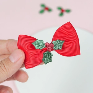 Red grosgrain ribbon Christmas bow hair clip with green holly leaves and red berries