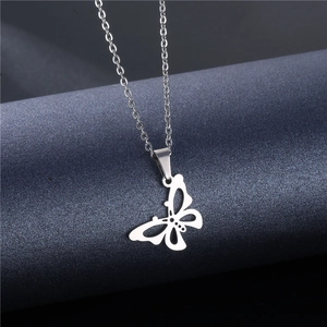 Minimalist hollow butterfly pendant necklace in silver stainless steel on display stand