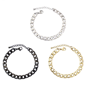 Close-up of chunky stainless steel Cuban link bracelets in gold, silver, and black finishes