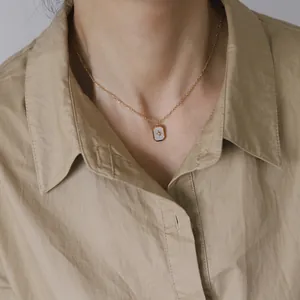 French style 18K gold plated star necklace with white shell inlay pendant on a model