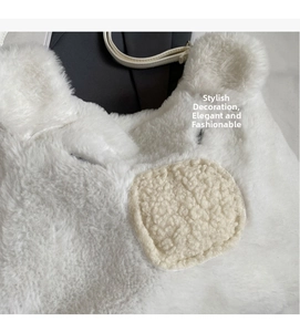 Detailed macro view of white faux fur material with beige fleece decorative patch