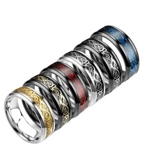Polished stainless steel rings featuring carbon fiber inlay and Celtic dragon patterns