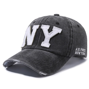 Vintage washed dark gray baseball cap with white NY embroidery and distressed brim detail