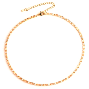 Detail of gold necklace with colorful zircon inlay, adjustable chain and lobster clasp