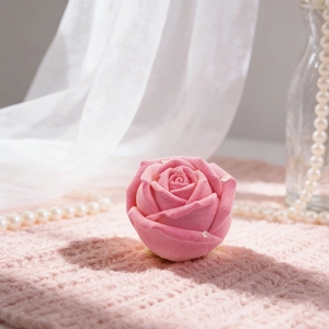 Pink velvet rose-shaped jewelry gift box with detailed petals and soft romantic aesthetic