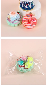 Detail of colorful artificial donut keychains with sprinkles and cream in OPP bag packaging