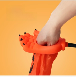 Close-up of Halloween monster palm candy bag featuring a wide opening for easy access