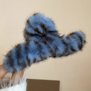 Detail of blue and black tiger striped plush hair claw clip with fuzzy faux fur texture