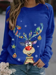 Detail of dark blue crewneck sweatshirt with festive colorful reindeer and snowflake print