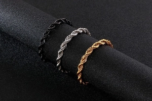 Macro shot of 6mm twisted rope chains in black, silver, and 18k gold plated finishes
