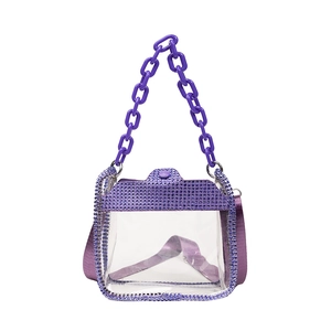 Purple transparent PVC handbag with rhinestone trim and chunky chain handle in a studio shot