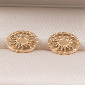 Detailed shot of golden sun-shaped hollow earrings in 304 stainless steel jewelry box