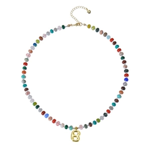 Detail of colorful beaded necklace featuring a metallic gold bubble letter B pendant