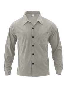 Macro detail of grey corduroy shirt showing chest pockets and ribbed fabric texture