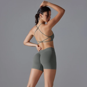Women's dark olive seamless knit yoga set with cross back sports bra and booty lifting shorts