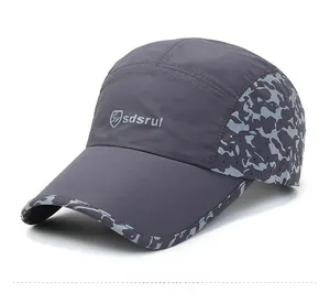 Detail of dark grey quick-dry baseball cap with laser-cut breathability and camo trim